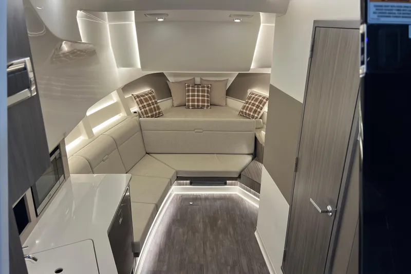 Slide: The Image of Luxurious interior of 2025 Sea Ray Sundancer 370 Outboard with modern seating and ambient lighting. - 16