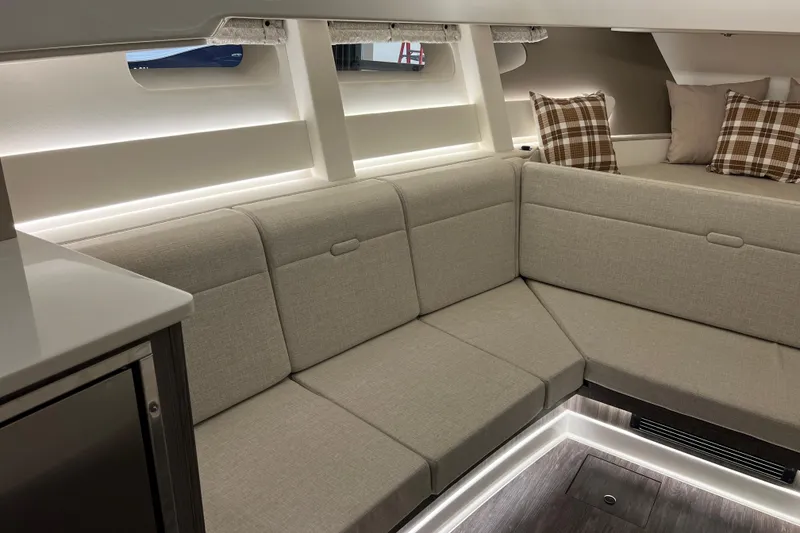 Slide: The Image of Luxurious interior of 2025 Sea Ray Sundancer 370 Outboard with plush seating and modern design. - 18