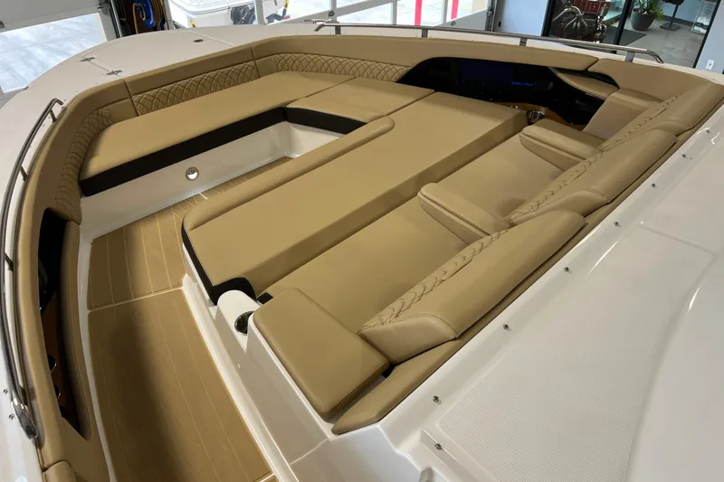 Slide: The Image of 2025 Sea Ray Sundancer 370 Outboard interior with luxurious tan seating and spacious layout. - 24
