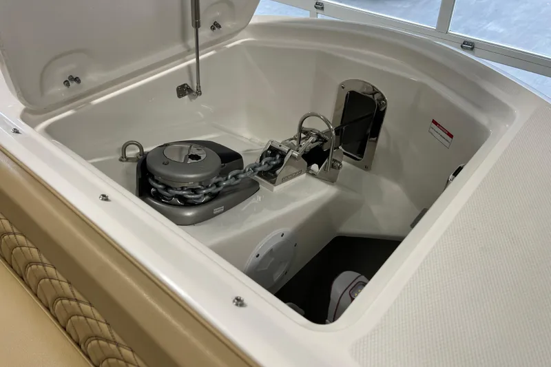 Slide: The Image of Anchor compartment of 2025 Sea Ray Sundancer 370 Outboard, featuring a modern chain system. - 26