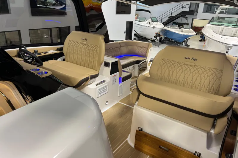 Slide: The Image of Luxurious interior of 2025 Sea Ray Sundancer 370 Outboard with elegant seating and modern design. - 29