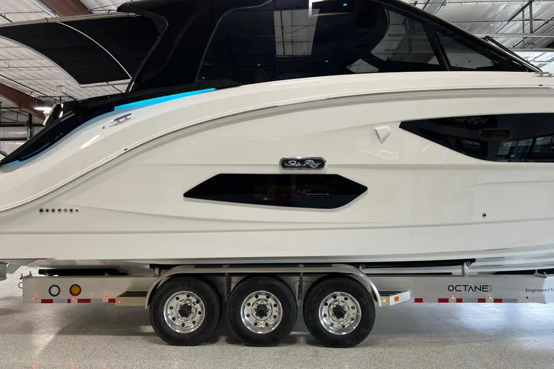 Slide: The Image of 2025 Sea Ray Sundancer 370 Outboard on trailer in indoor showroom. - 3