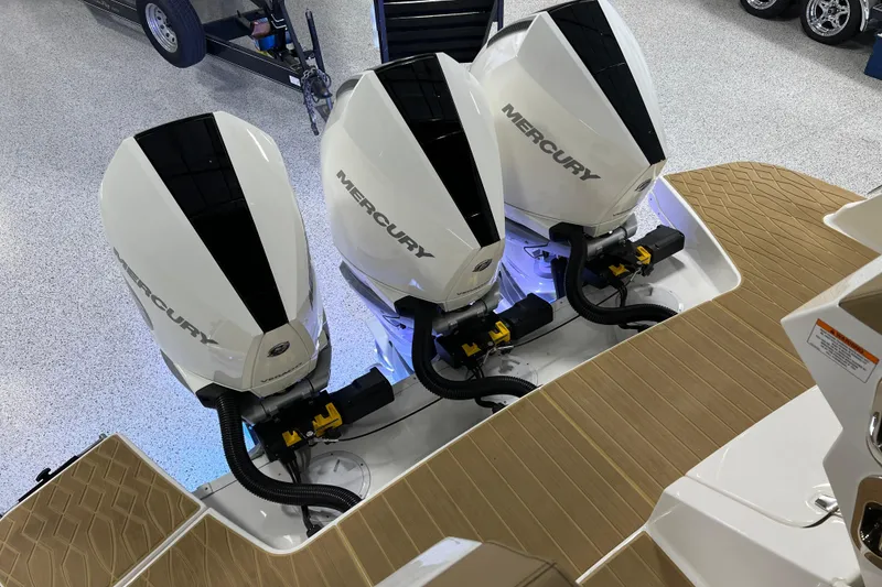 Slide: The Image of Triple Mercury outboard engines on a 2025 Sea Ray Sundancer 370 boat. - 32