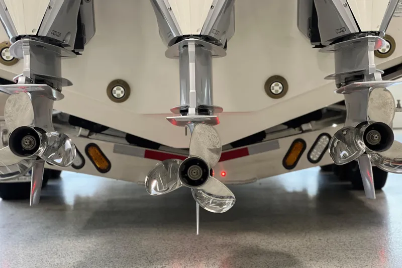 Slide: The Image of 2025 Sea Ray Sundancer 370 Outboard with triple propellers, showcasing advanced marine engineering. - 38
