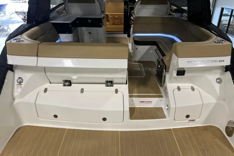 Slide: The Image of 2025 Sea Ray Sundancer 370 Outboard interior with tan seating and sleek design. - 5