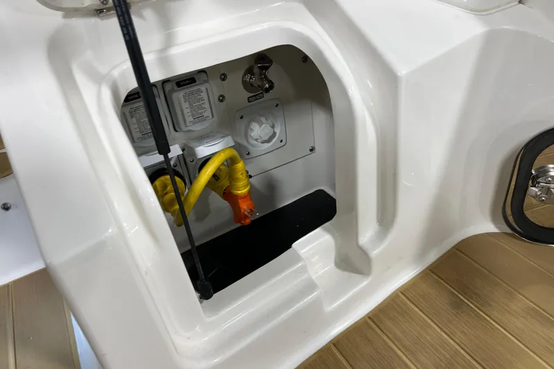 Slide: The Image of 2025 Sea Ray Sundancer 370 Outboard electrical compartment with cables and connectors. - 8