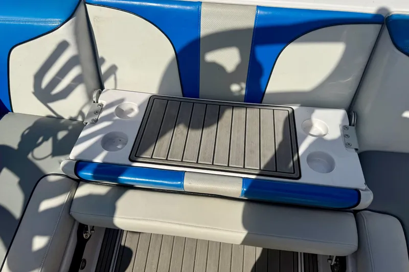 Slide: The Image of Interior of 2000 Correct Craft Super Air Nautique boat with blue and gray seating. - 11