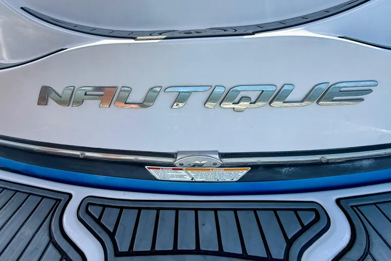 Slide: The Image of Close-up of 2000 Correct Craft Super Air Nautique logo on boat's rear deck. - 13