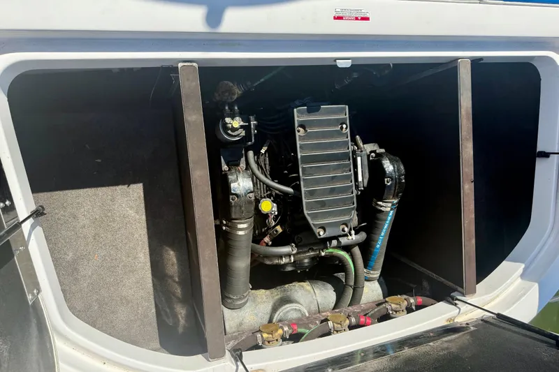 Slide: The Image of Engine compartment of a 2000 Correct Craft Super Air Nautique boat. - 18