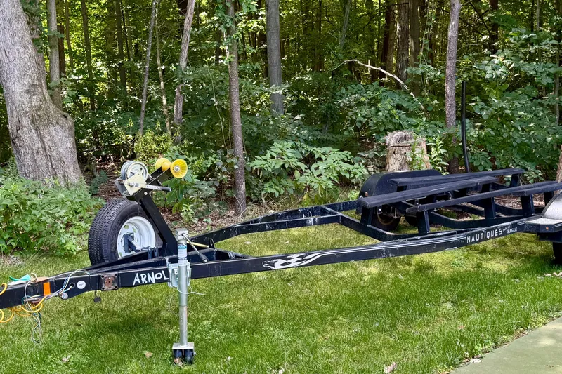 Slide: The Image of Trailer for 2000 Correct Craft Super Air Nautique in wooded area. - 19