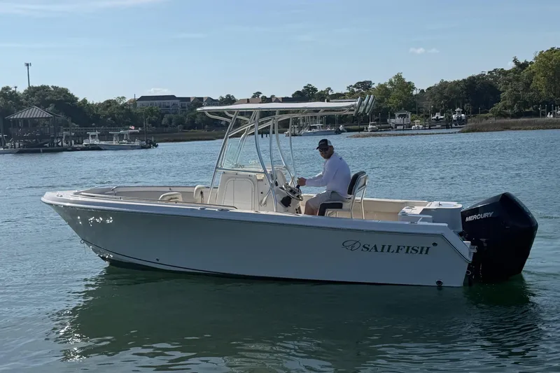 Slide: The Image of 2023 Sailfish 220 CC boat on calm water. - 3