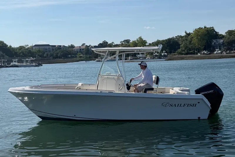 Slide: The Image of 2023 Sailfish 220 CC boat on calm water. - 4