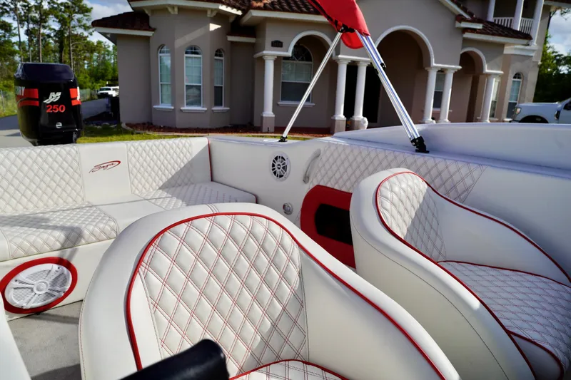 Slide: The Image of 1996 Baja 20 Outlaw boat interior with white and red quilted seats. - 11