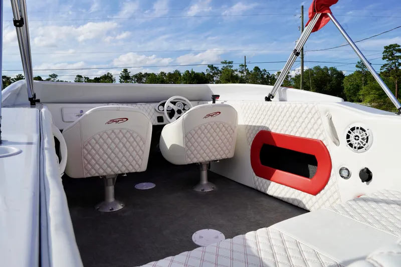 Slide: The Image of Interior of a 1996 Baja 20 Outlaw boat with white and red seating. - 13