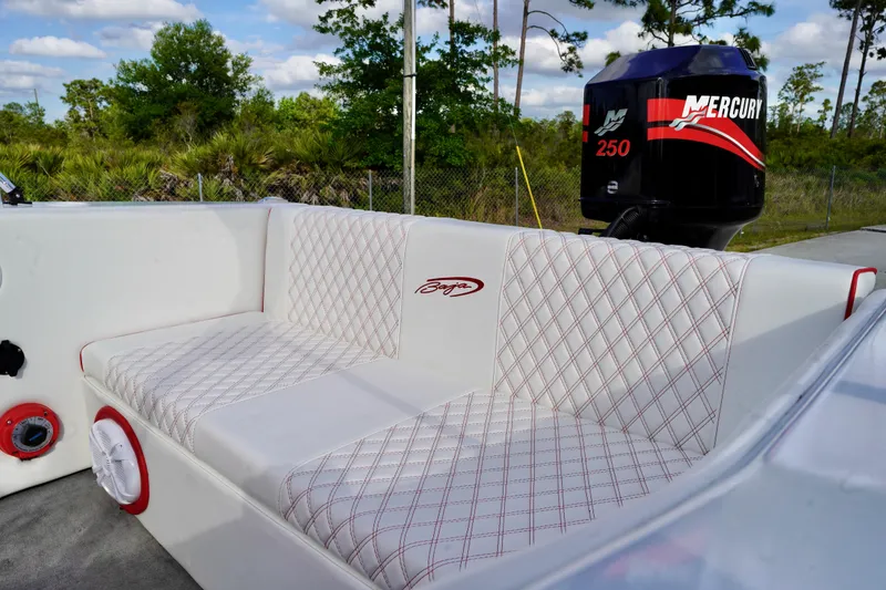 Slide: The Image of 1996 Baja 20 Outlaw boat interior with Mercury 250 engine, featuring quilted seating. - 14