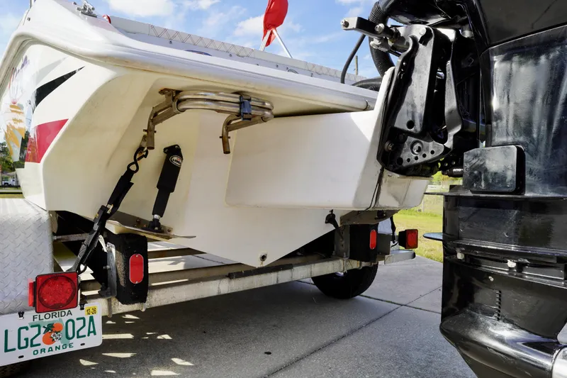 Slide: The Image of 1996 Baja 20 Outlaw boat on trailer with Florida license plate. - 16