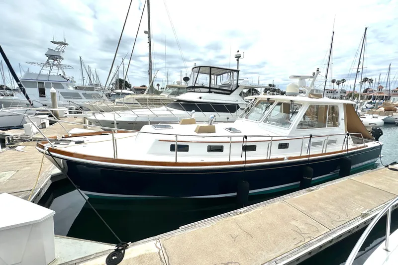 The Image of 2003 Grand Banks 43 Eastbay HX yacht docked at marina, showcasing sleek design and classic style. - 1