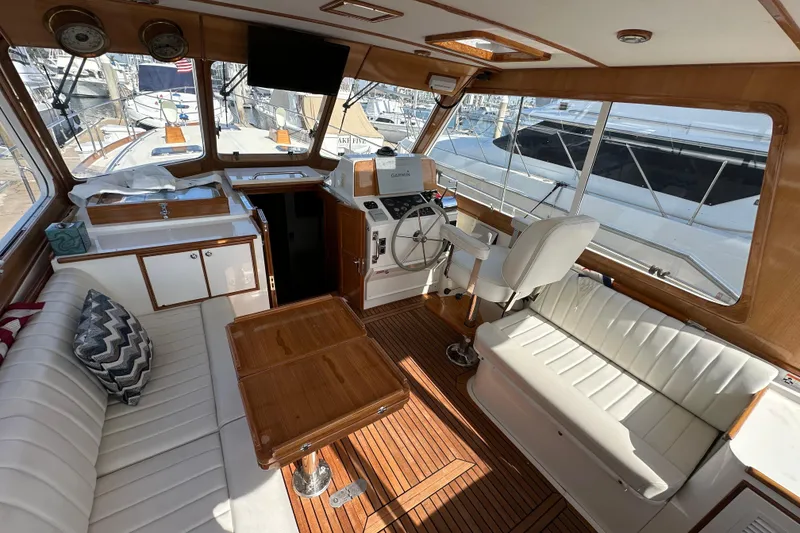 Slide: The Image of Interior of 2003 Grand Banks 43 Eastbay HX yacht with elegant seating and helm station. - 14