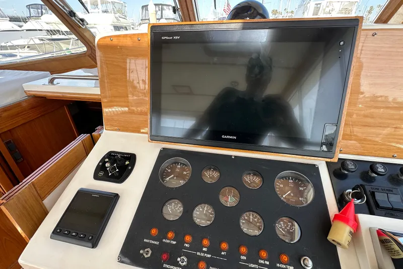 Slide: The Image of Helm of 2003 Grand Banks 43 Eastbay HX with Garmin GPS and control gauges. - 17