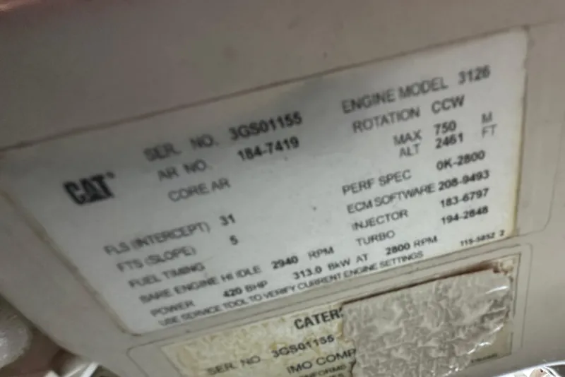 Slide: The Image of Engine specifications label for 2003 Grand Banks 43 Eastbay HX, featuring CAT model 3126. - 30