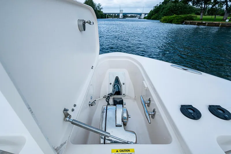 Slide: The Image of 2020 Grady-White Canyon 336 boat anchor compartment with scenic waterway view. - 21
