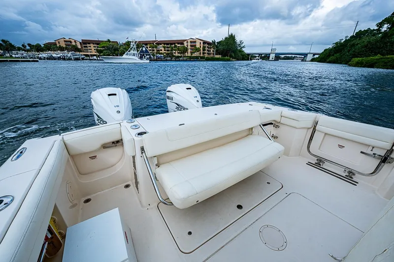 Slide: The Image of 2020 Grady-White Canyon 336 boat with dual Yamaha engines on a scenic waterway. - 25