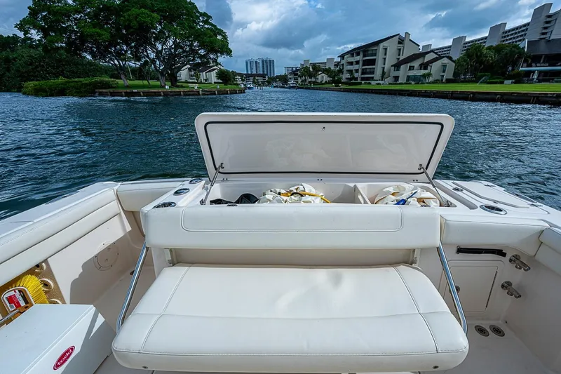 Slide: The Image of 2020 Grady-White Canyon 336 boat with open storage, cruising on a scenic waterway. - 27