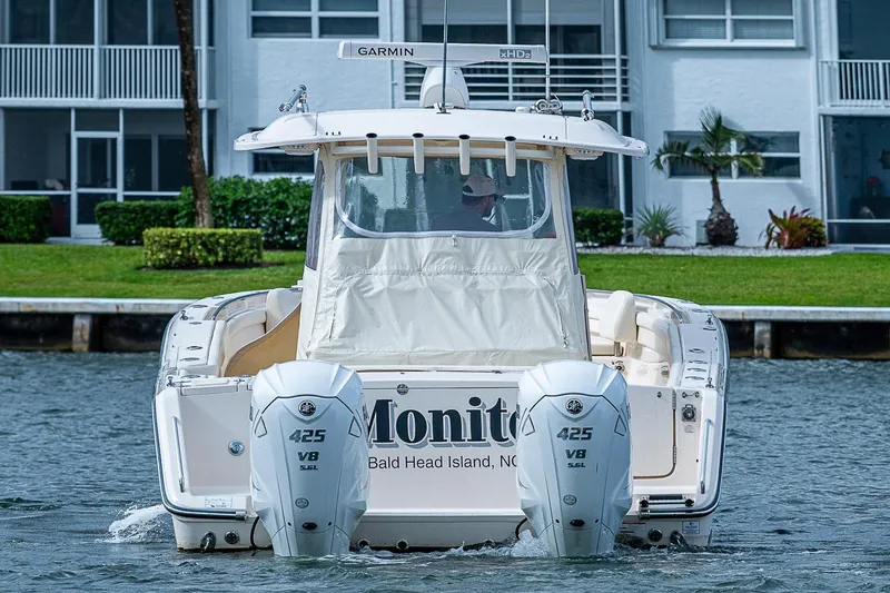 Slide: The Image of 2020 Grady-White Canyon 336 boat with twin 425 V8 engines on water. - 3