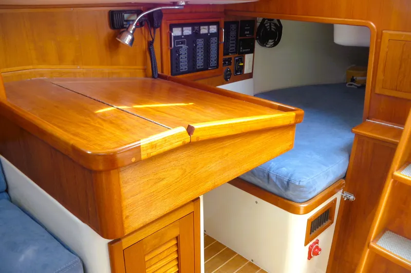 Slide: The Image of Interior of 2009 Pacific Seacraft 34 sailboat with wooden cabinetry and cozy sleeping area. - 5