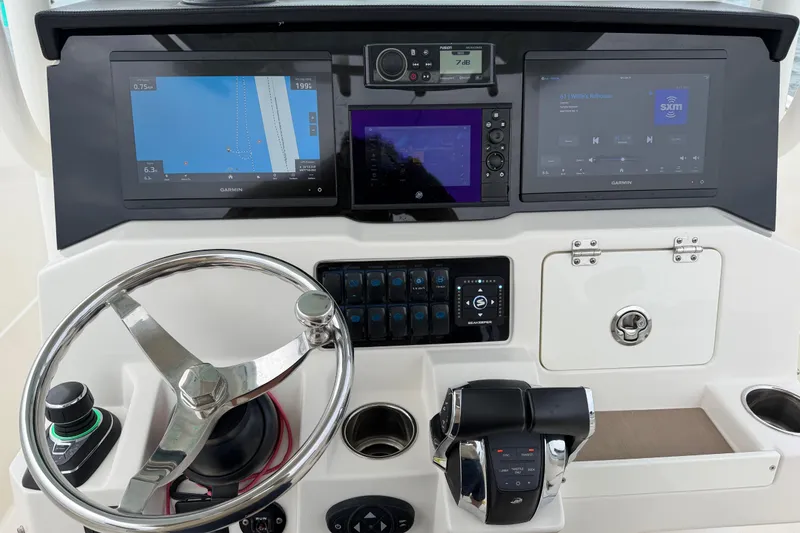 Slide: The Image of Dashboard of 2021 Sailfish 290 CC boat with navigation and control systems. - 24