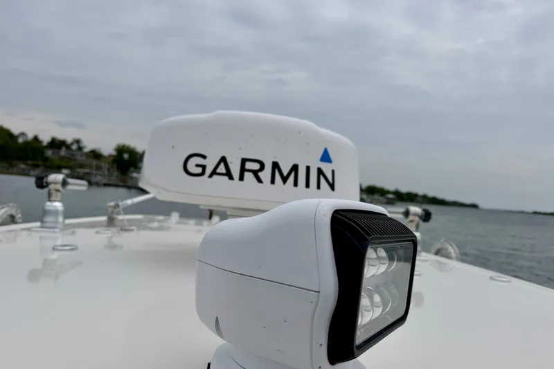 Slide: The Image of 2021 Sailfish 290 CC boat with Garmin radar and spotlight on deck. - 32