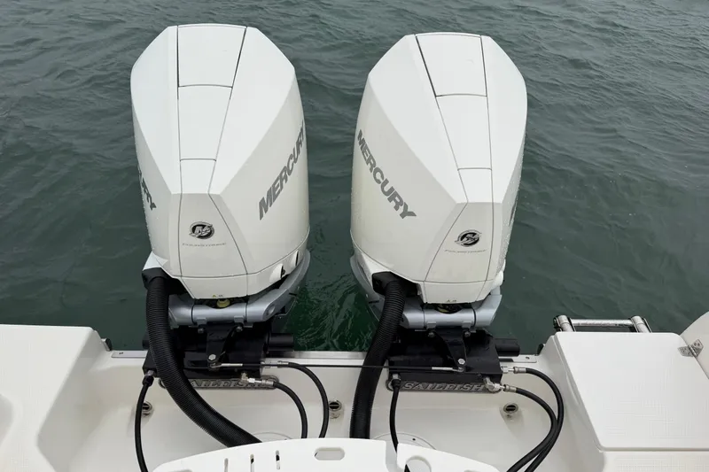 Slide: The Image of Twin Mercury outboard engines on a 2021 Sailfish 290 CC boat, viewed from above. - 33