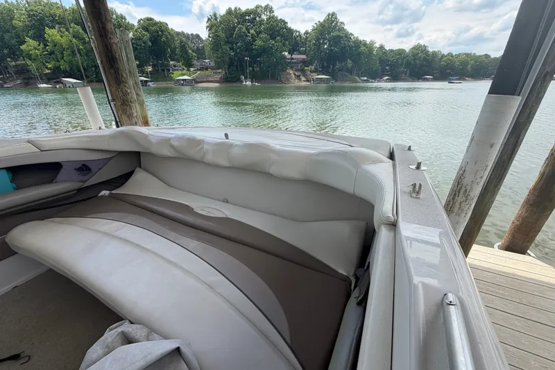Slide: The Image of 1998 Four Winns 220 Horizon boat interior with lake view and dock. - 16