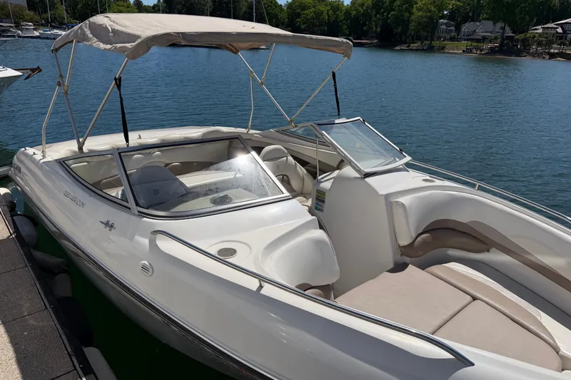 Slide: The Image of 1998 Four Winns 220 Horizon boat docked on a sunny lake with canopy. - 7
