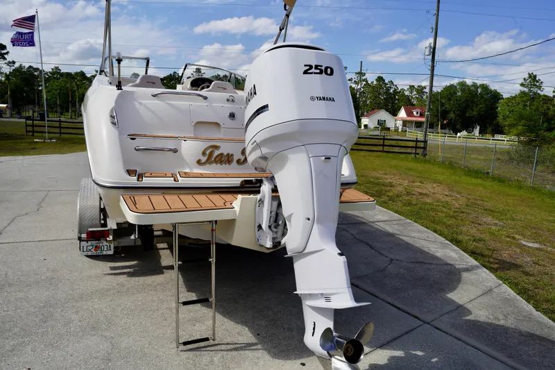 Slide: The Image of 2001 Stingray 240 LS boat with Yamaha 250 outboard motor on trailer. - 29