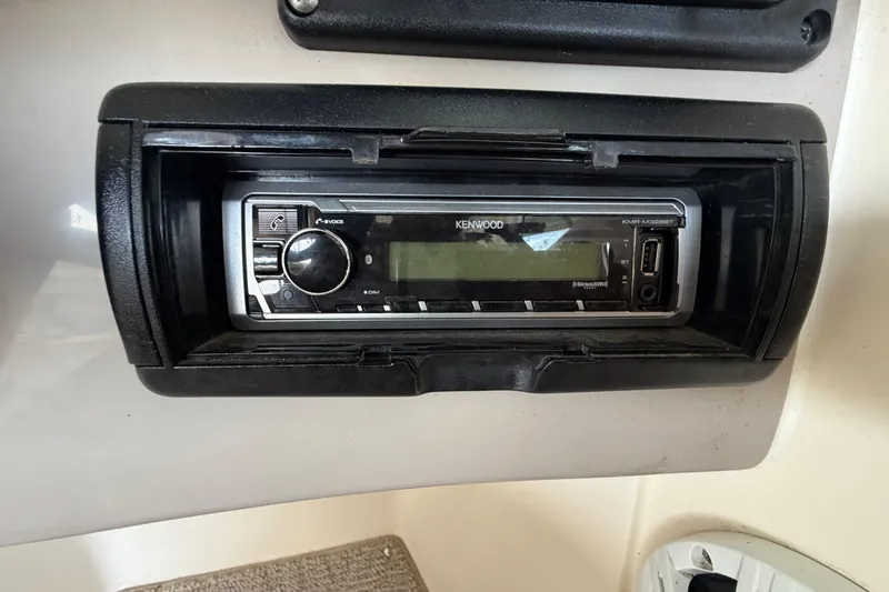 Slide: The Image of Kenwood stereo system in 2005 Rinker 282 Captiva Bowrider boat dashboard. - 15