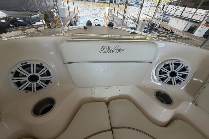 Slide: The Image of Interior of a 2005 Rinker 282 Captiva Bowrider with speakers and cup holders. - 20