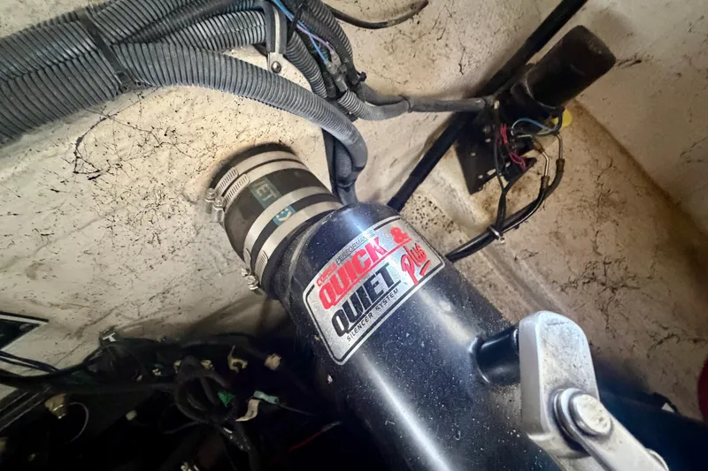 Slide: The Image of Engine compartment of a 2005 Rinker 282 Captiva Bowrider with Quick & Quiet Plus exhaust system. - 25