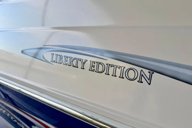 Slide: The Image of 2005 Rinker 282 Captiva Bowrider, Liberty Edition logo on boat exterior. - 26