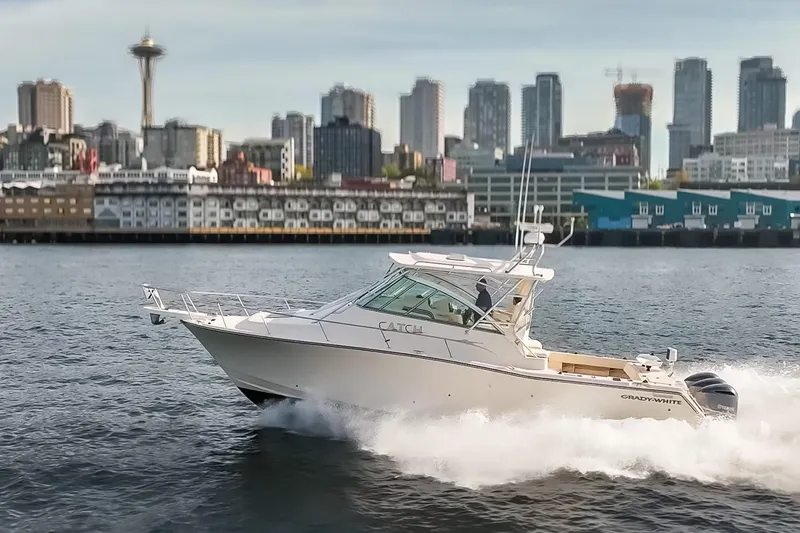 Slide: The Image of 2006 Grady-White Express 360 cruising in Seattle waters with city skyline backdrop. - 10