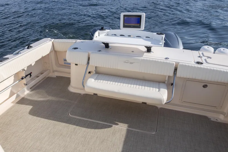 Slide: The Image of 2006 Grady-White Express 360 boat interior with seating and navigation equipment. - 14
