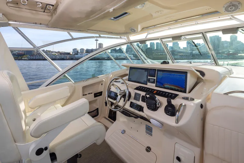 Slide: The Image of 2006 Grady-White Express 360 helm with city skyline view, featuring advanced navigation systems. - 17