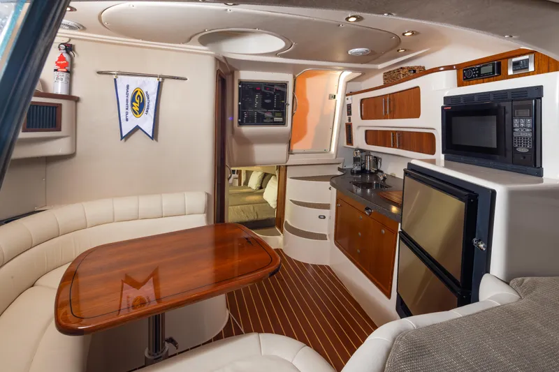 Slide: The Image of Luxurious 2006 Grady-White Express 360 yacht interior with kitchenette and dining area. - 20