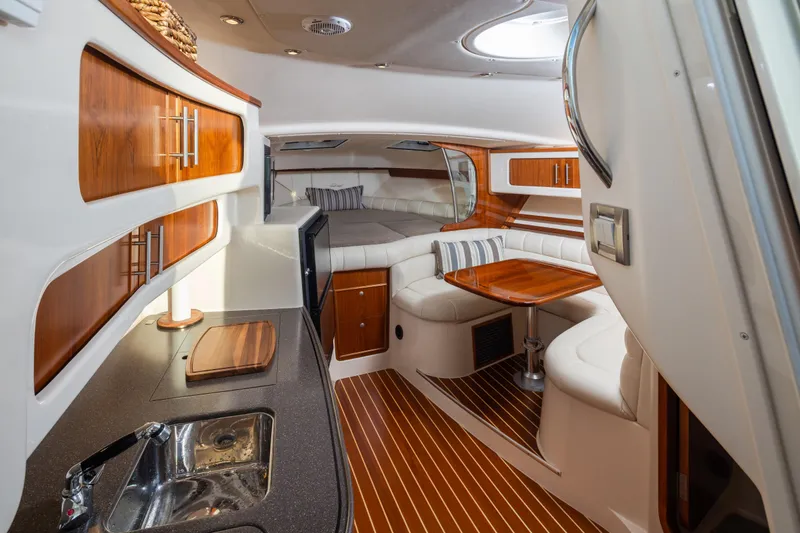 Slide: The Image of Luxurious 2006 Grady-White Express 360 cabin interior with wood accents and modern amenities. - 21