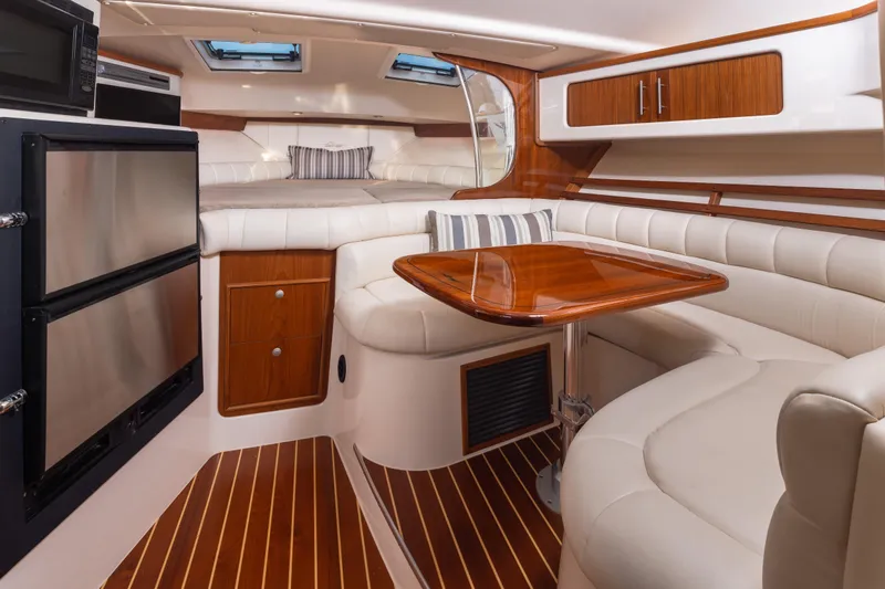 Slide: The Image of Luxurious interior of 2006 Grady-White Express 360 boat with elegant seating and wood finishes. - 22