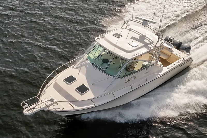 Slide: The Image of 2006 Grady-White Express 360 boat cruising on water, aerial view. - 3