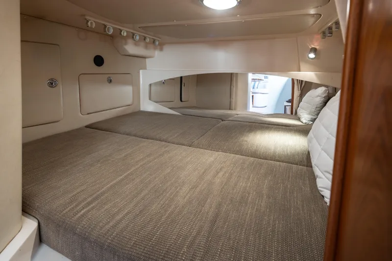 Slide: The Image of Interior cabin of 2006 Grady-White Express 360 boat, featuring cozy sleeping area. - 30
