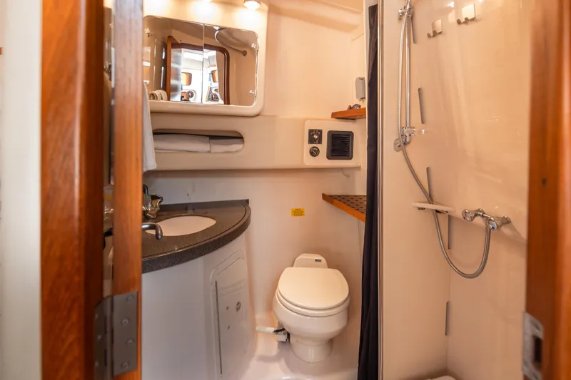 Slide: The Image of 2006 Grady-White Express 360 boat bathroom with shower, sink, and toilet. - 31
