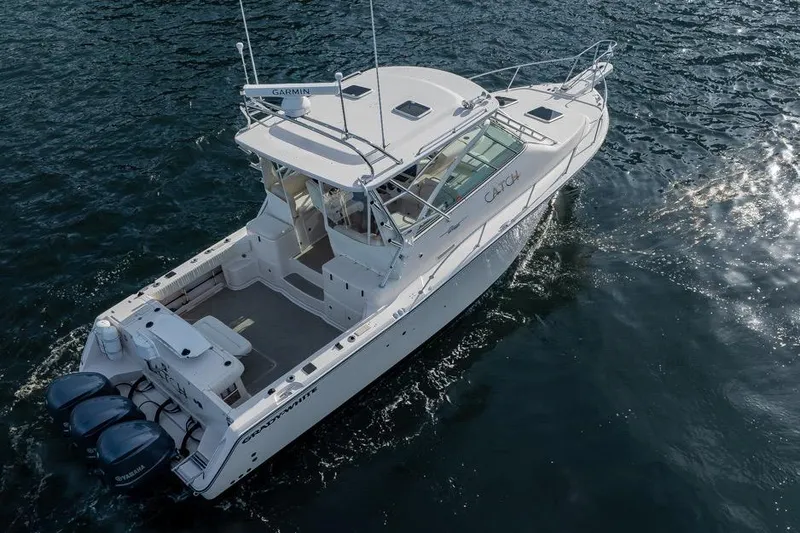 Slide: The Image of 2006 Grady-White Express 360 boat cruising on open water, aerial view. - 5
