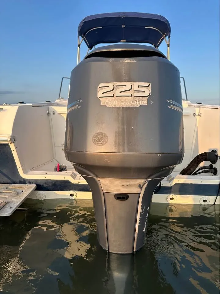 Slide: The Image of 2004 Wellcraft WALK AROUND boat with 225 horsepower outboard motor. - 3